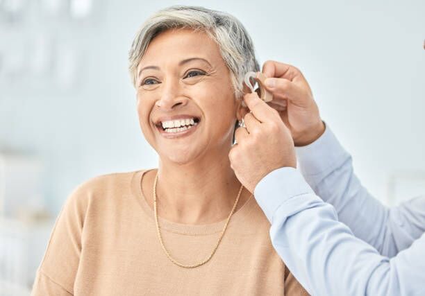 Senior patient, hearing aid and doctor hands, ear and listening, help and trust, healthcare and medicine. Medical tech, consultation with ENT specialist and health, happy woman and people at clinic Senior patient, hearing aid and doctor hands, ear and listening, help and trust, healthcare and medicine. Medical tech, consultation with ENT specialist and health, happy woman and people at clinic hearing aids stock pictures, royalty-free photos & images